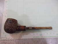 A pipe pyrographed by the soc