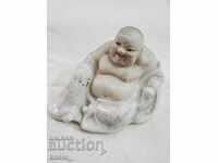 Porcelain Buddha figurine