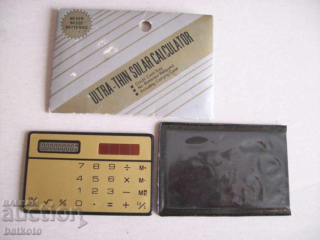Auction  Miniature slim calculator