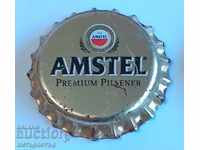 Amstel χρυσό καπάκι