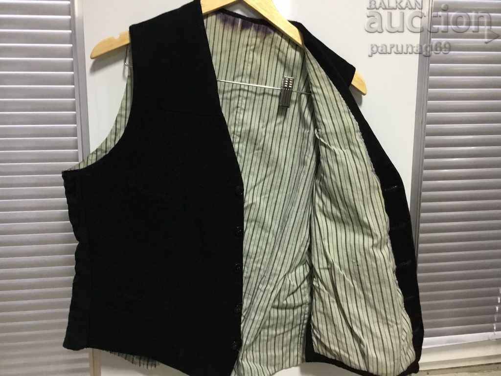 Delivery of REVIVAL Old men's vest from the 20s. of the 20th Century with a BADGE Delivery of REVIVAL Old men's vest from the 20s. of the 20th Century with a BADGE