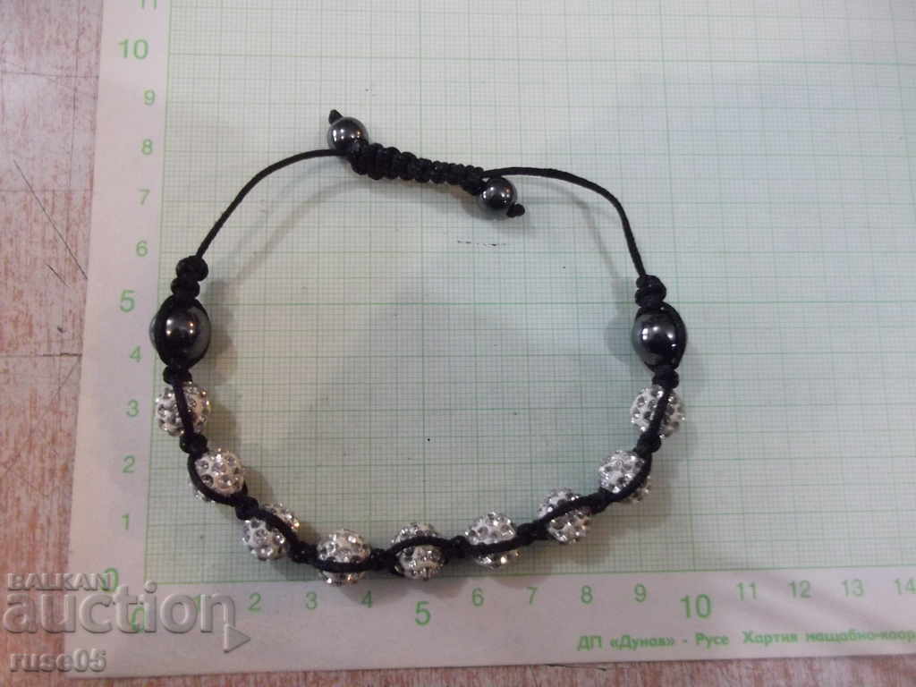 Auction Bracelet made of spheres inlaid with stones Auction Bracelet made of spheres inlaid with stones