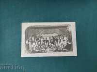 People in traditional costumes, ensemble, stage