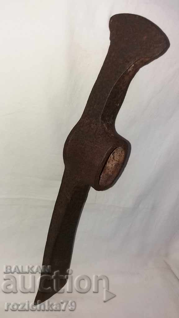 Old forged pickaxe tool