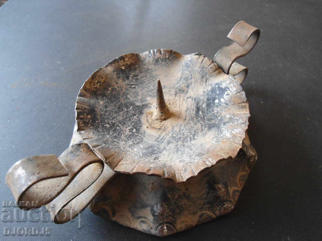 Delivery of Old wrought iron candlestick Delivery of Old wrought iron candlestick