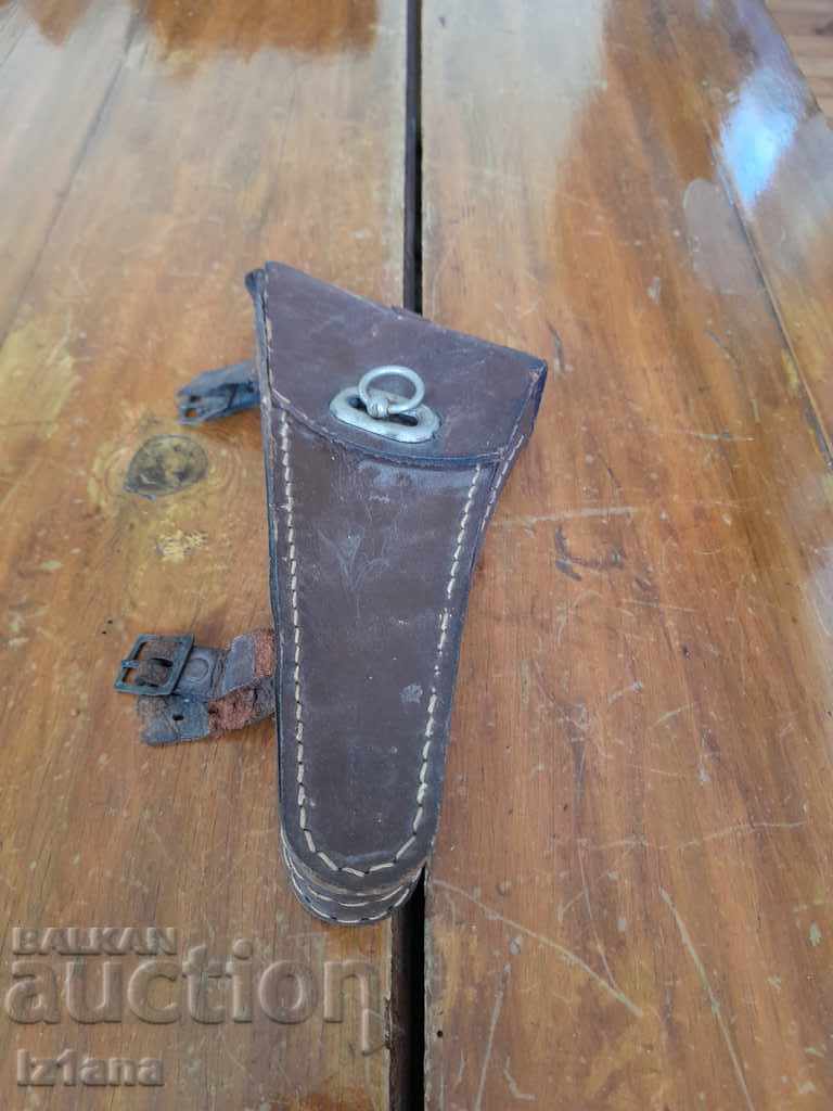 An old leather bag for a bicycle, a bicycle