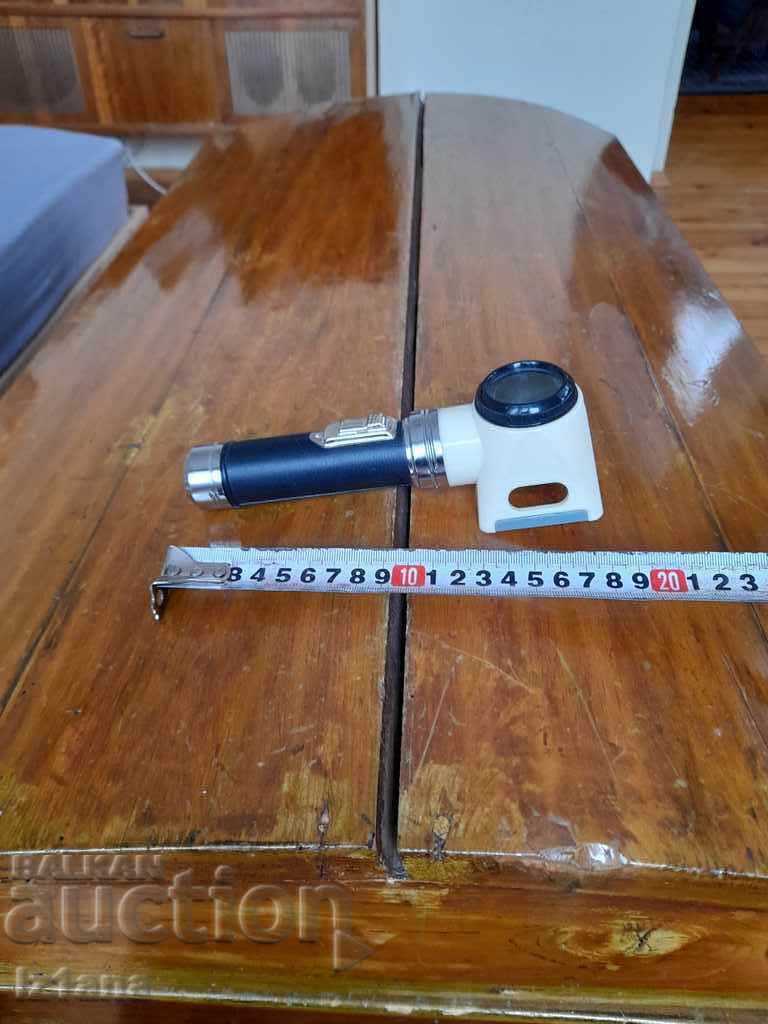 Delivery of Old flashlight with magnifying glass Delivery of Old flashlight with magnifying glass