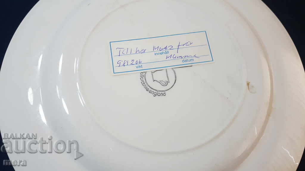 Auction Lot of three porcelain designer plates Auction Lot of three porcelain designer plates