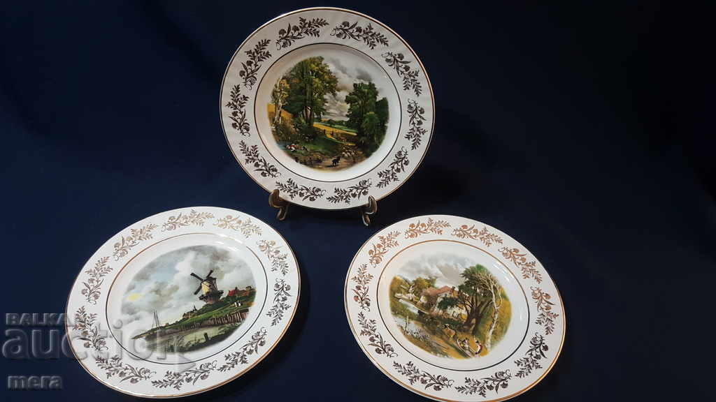 Lot of three porcelain designer plates