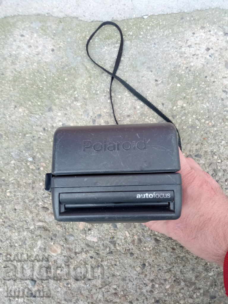 Auction Polaroid camera Auction Polaroid camera