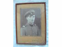 Large picture in a frame A soldier in a uniform of the tsarist era
