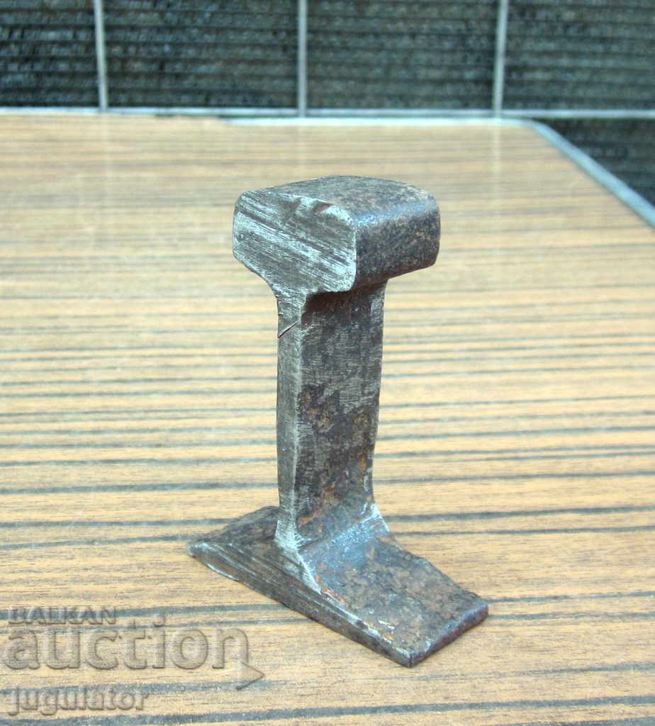 an old jewelry watchmaker's small anvil