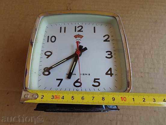 Delivery of An old Chinese clock, an alarm clock - the 80's of the twentieth century Delivery of An old Chinese clock, an alarm clock - the 80's of the twentieth century