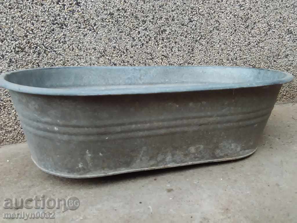 Old galvanized trough, household dish basin