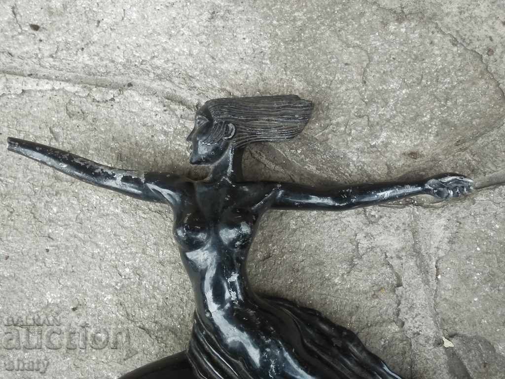 Delivery of Old metal sculpture. Car emblem. Delivery of Old metal sculpture. Car emblem.