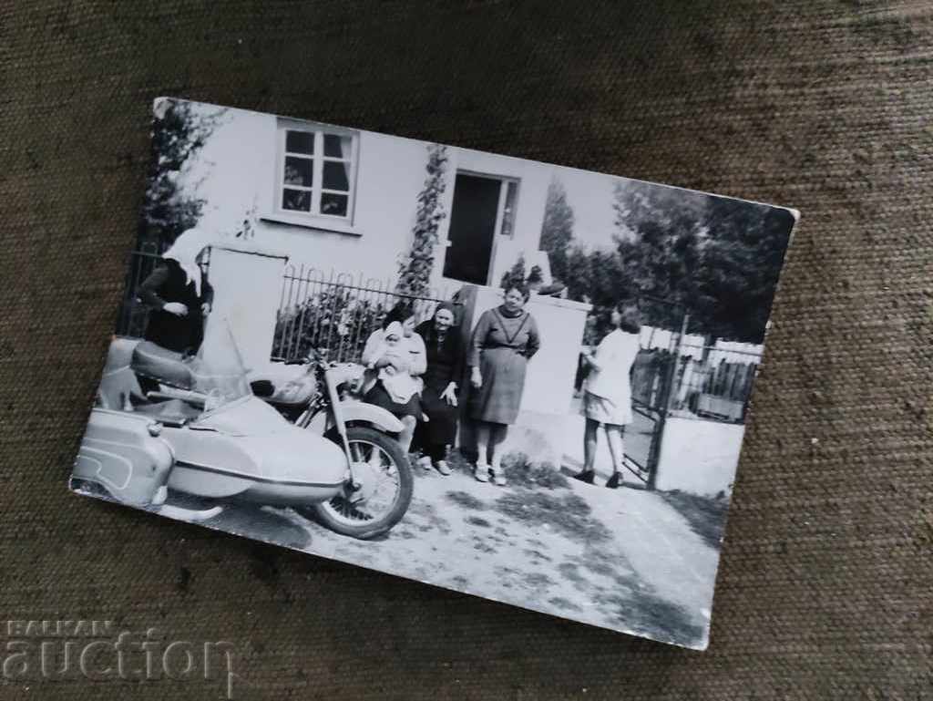 grandmother to a motorcycle with a basket