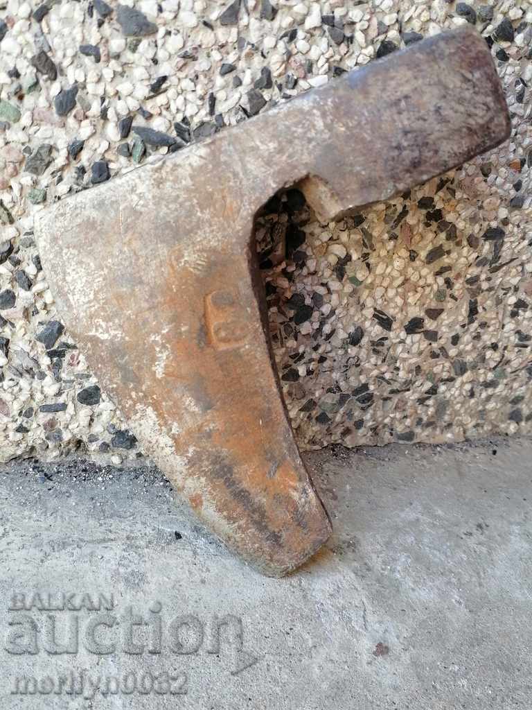 An old ax tool wrought iron