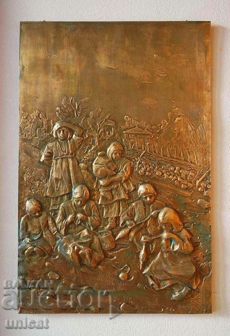 Women on a seat, an old copper panel