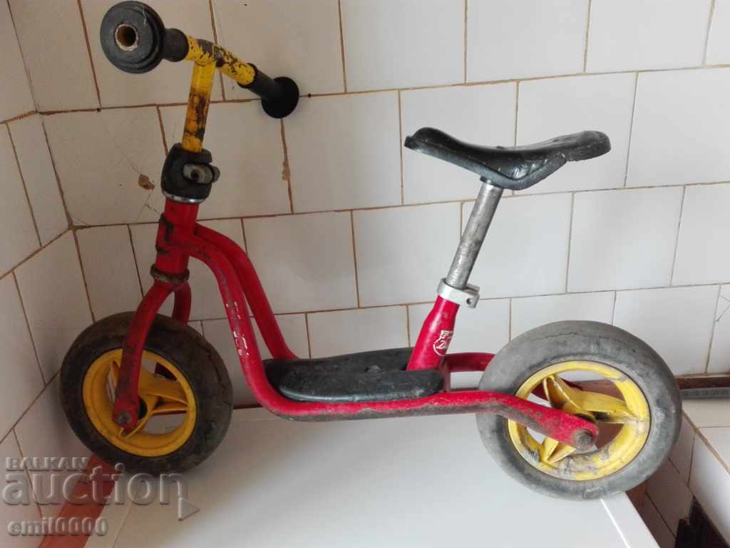 Old children's bicycle (scooter).