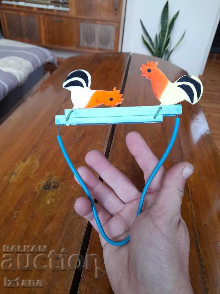 Delivery of Old toy rooster Delivery of Old toy rooster