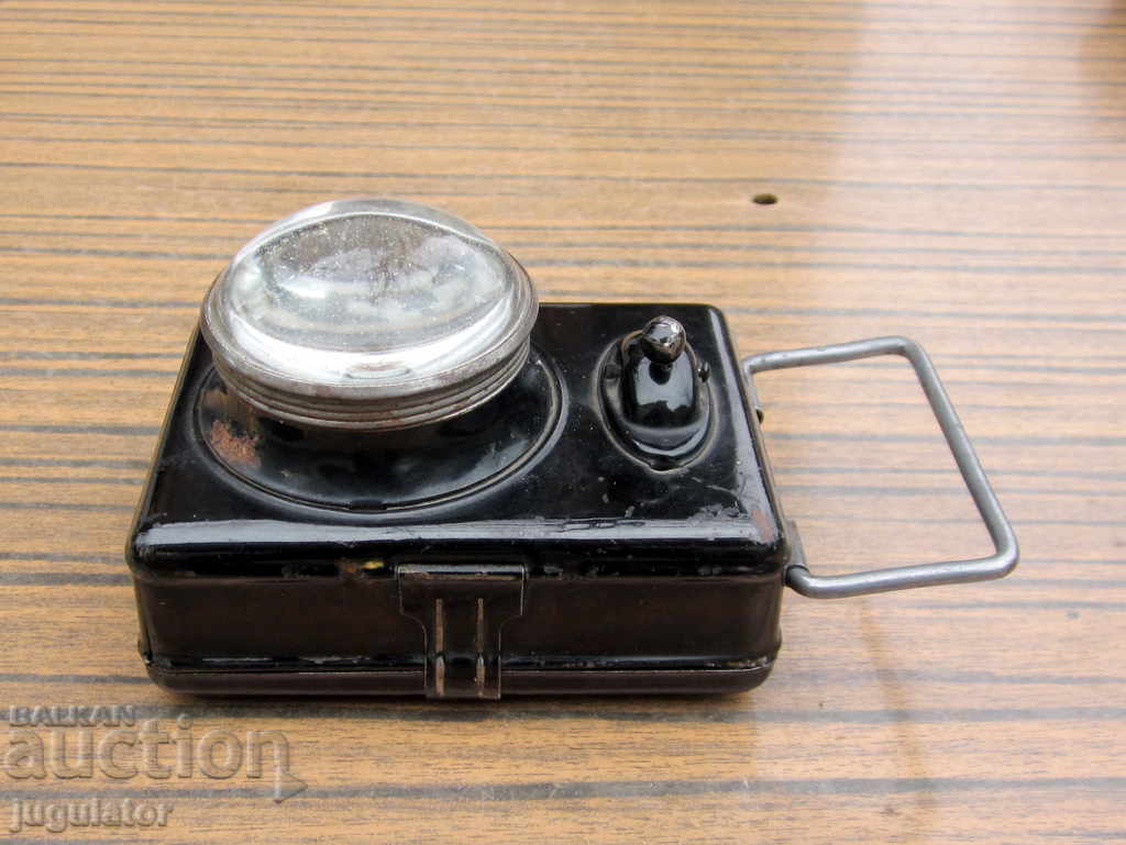 Delivery of WWII German soldier's flashlight HAWE lantern