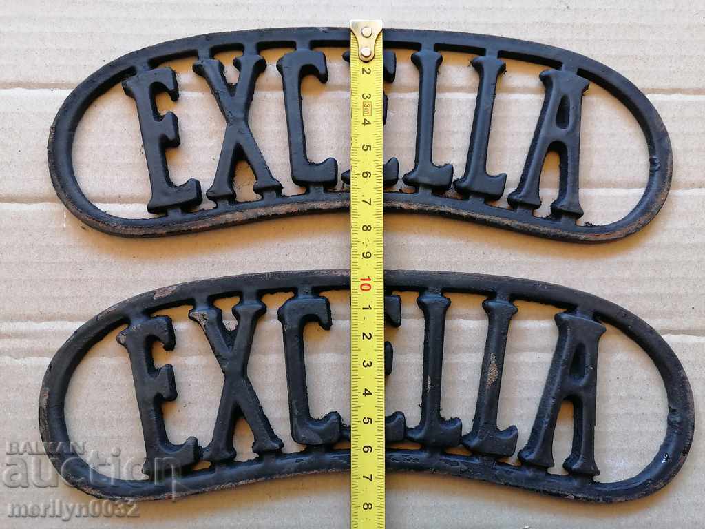 Auction EXCELLA emblem, cast iron, from a sewing machine Auction EXCELLA emblem, cast iron, from a sewing machine