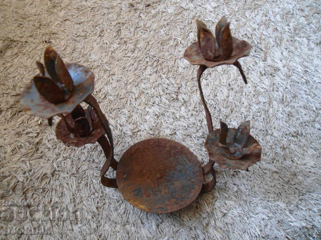 An old metal candleholder with price 4.00 BGN | € 2.05 An old metal candleholder with price 4.00 BGN | € 2.05