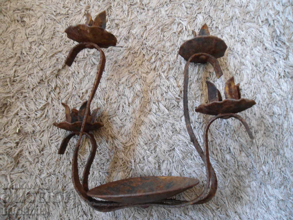 Auction An old metal candleholder Auction An old metal candleholder