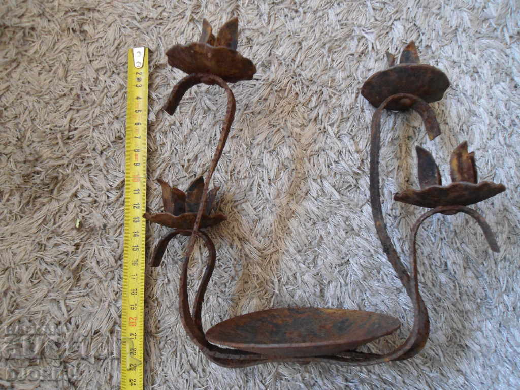 Delivery of An old metal candleholder Delivery of An old metal candleholder