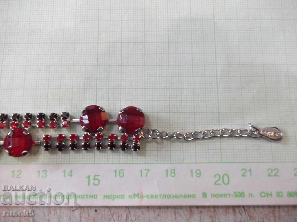 Delivery of Hand chain with red stones imitation jewelry Delivery of Hand chain with red stones imitation jewelry
