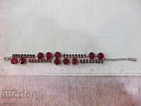 Hand chain with red stones imitation jewelry