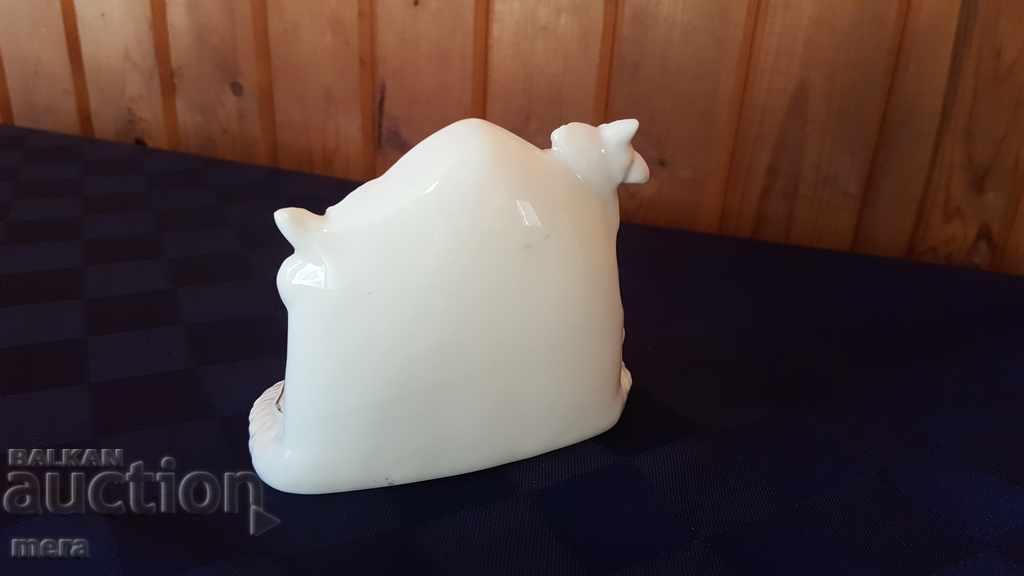 Auction Porcelain figurine with a religious motif Auction Porcelain figurine with a religious motif