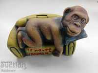 A monkey's piggy bank lay Trojan pottery