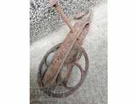 Old wrought iron pulley reel primitive wrought iron