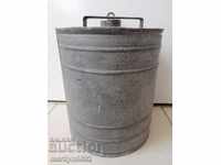 Old galvanized metal tube, bucket, container