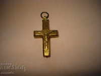 A gilded cross (bronze) opens