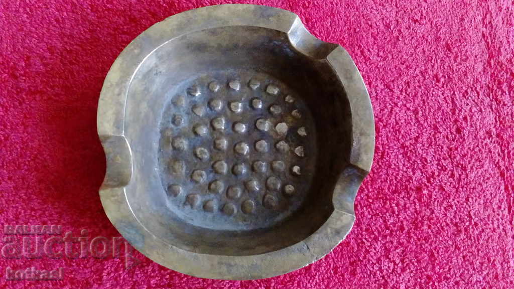 Old metal bronze ashtray