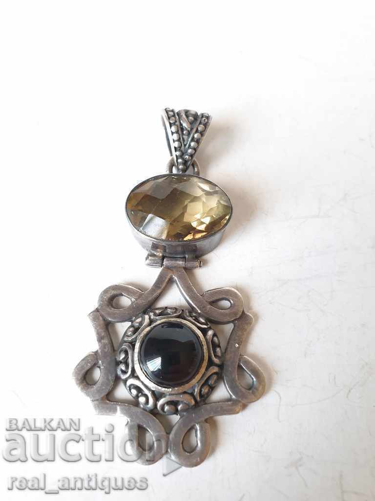 Old silver pendant with natural stones