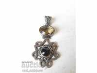 Old silver pendant with natural stones