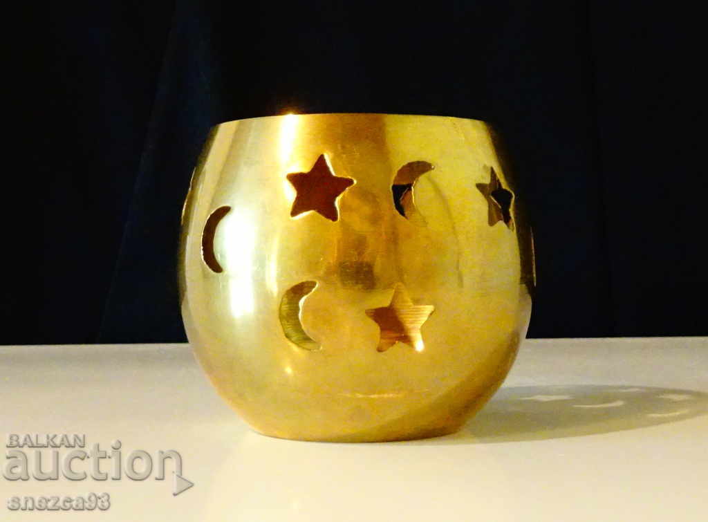 Bronze candlestick with openwork moon, stars.