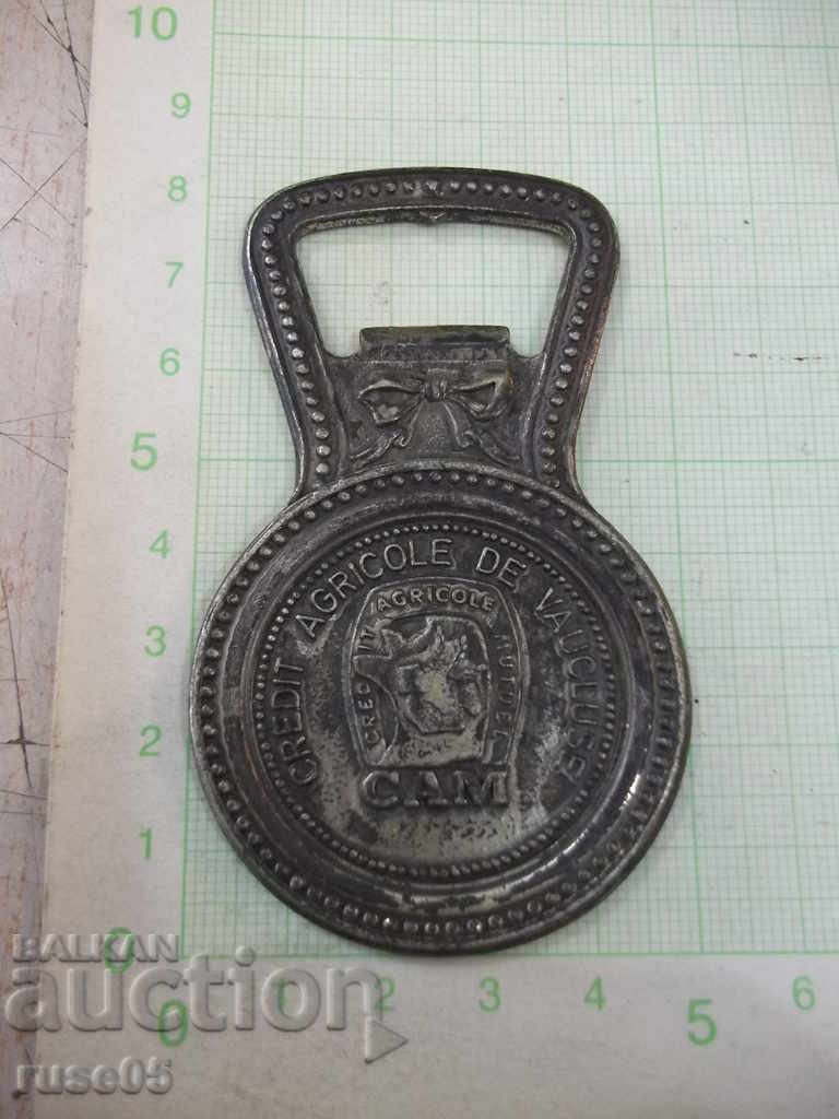 Auction Bronze bottle opener Auction Bronze bottle opener