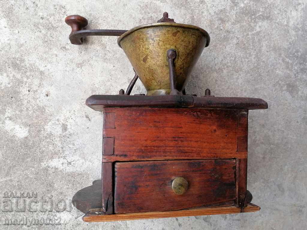 Delivery of An old coffee grinder at least 140 years old Delivery of An old coffee grinder at least 140 years old