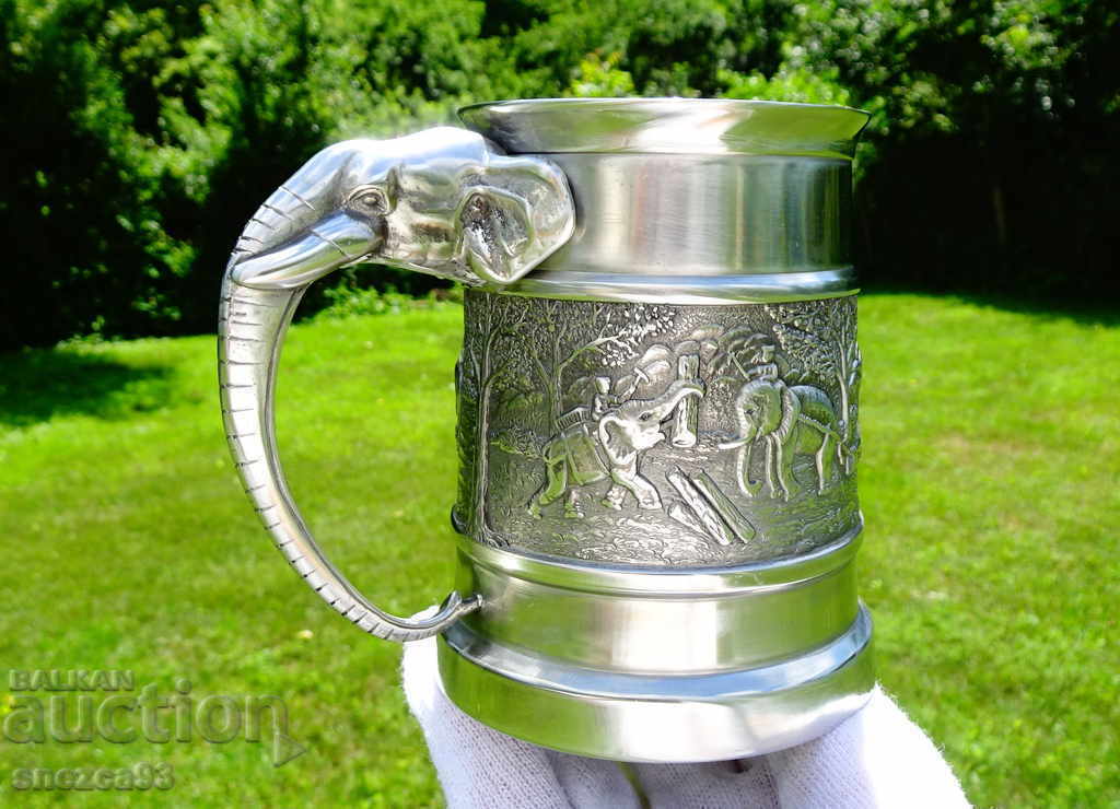 Mug with a pewter Elephant.