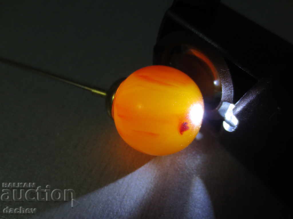 Delivery of A rare needle with a large amber ornament from the beginning of the 20th Century Delivery of A rare needle with a large amber ornament from the beginning of the 20th Century