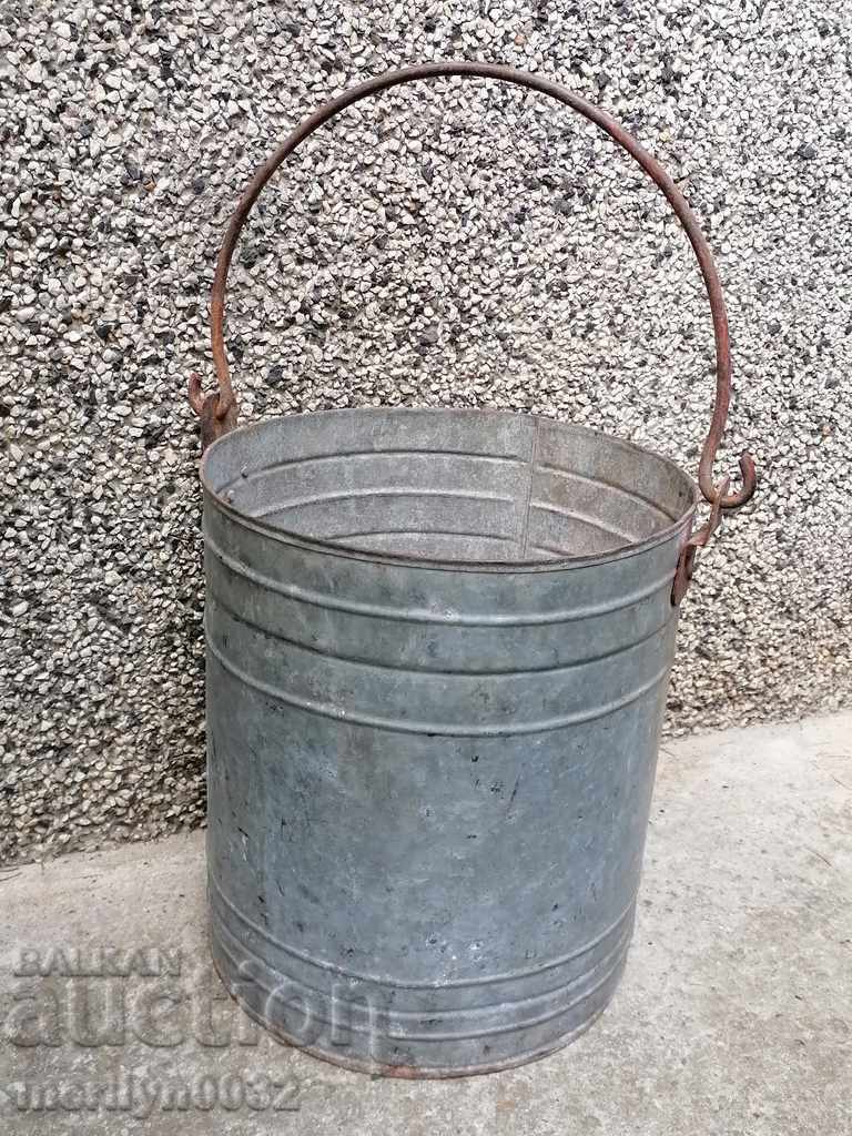 Old metal bucket, can of gum