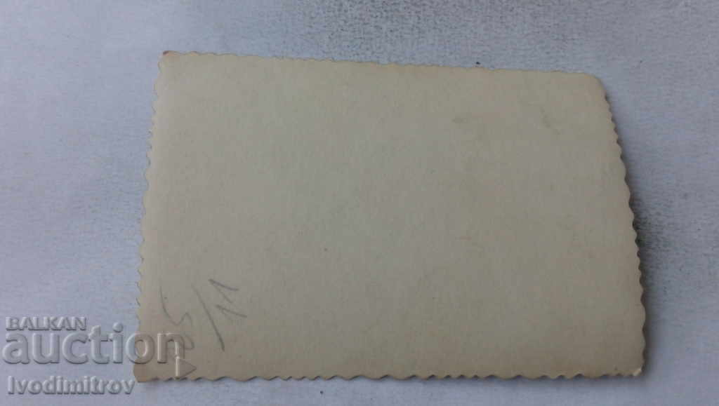 Photo Man and woman walking past the Edirne store with price 1.85 BGN | € 0.95 Photo Man and woman walking past the Edirne store with price 1.85 BGN | € 0.95