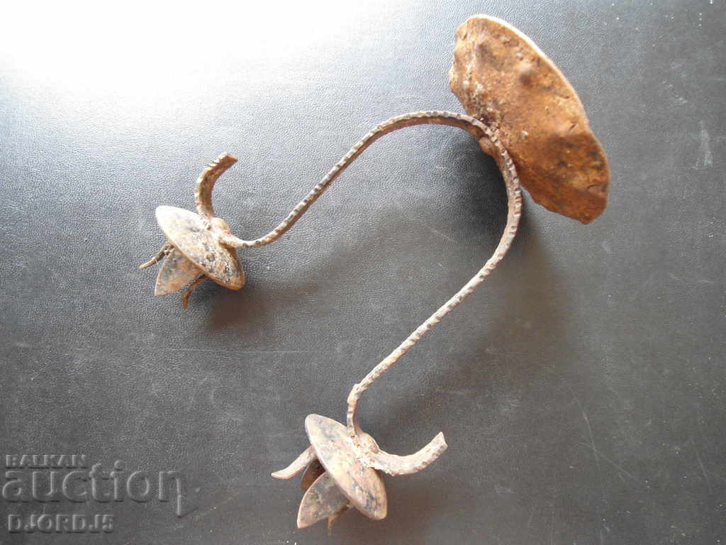 An old forged candlestick with price 4.00 BGN | € 2.05