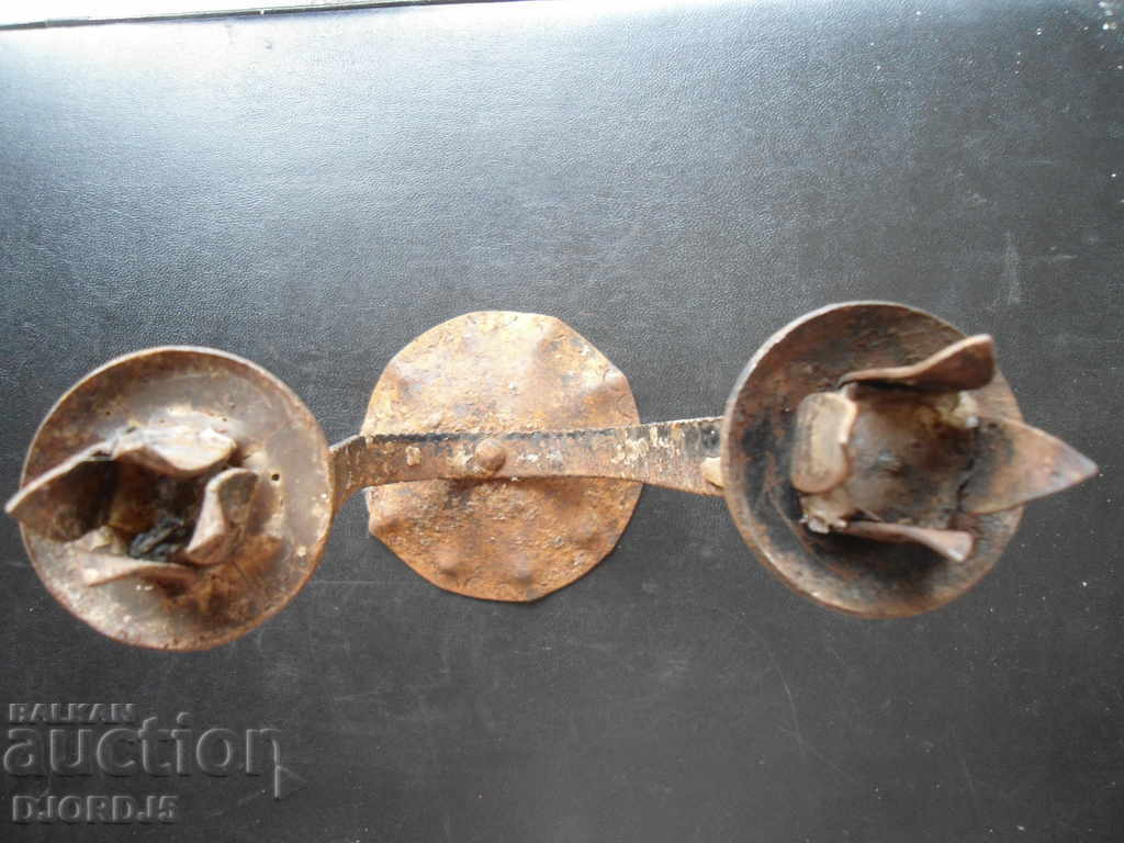 Auction  An old forged candlestick