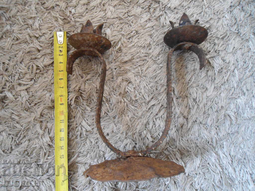 Delivery of An old forged candlestick