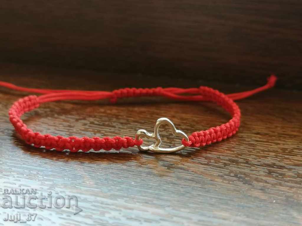 New silver bracelet with red thread